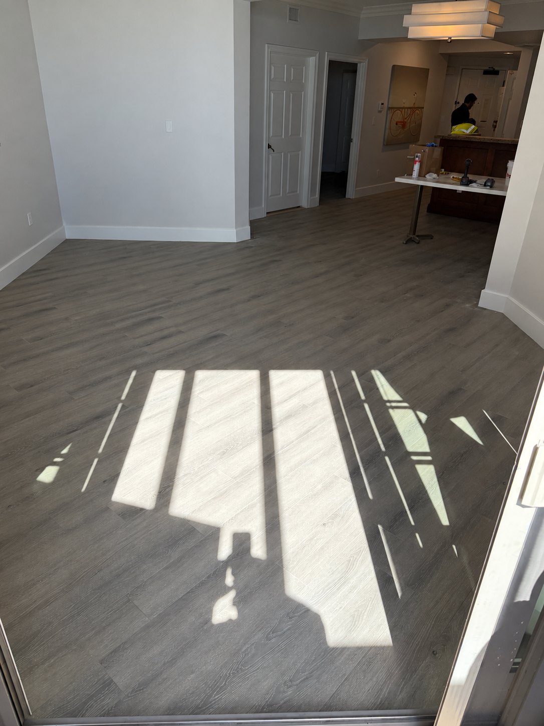 Finished luxury vinyl plank flooring · ladder removed from photo
